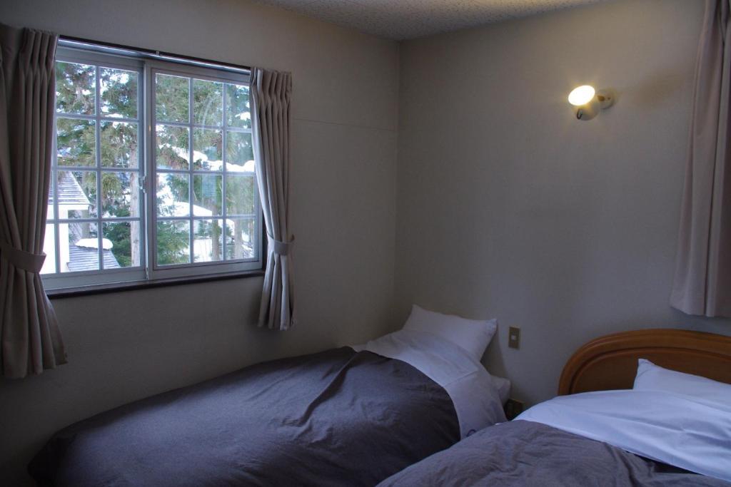ซันนี่ ไซด์ ฮัท Bed & Breakfast ฮาคุบะ ห้อง รูปภาพ